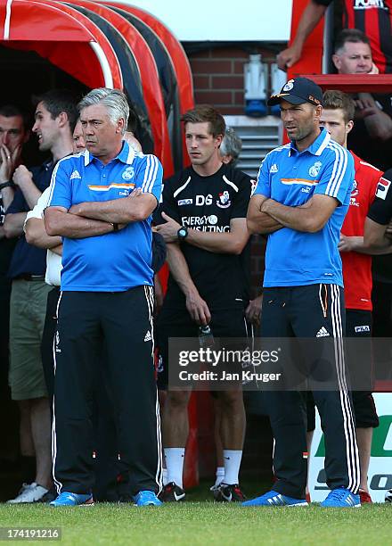 Manager of Real Madrid Carlo Ancelotti and Assistant Manager of Real Madrid Zinedine Zidane looks on ahead of the pre season friendly match between...