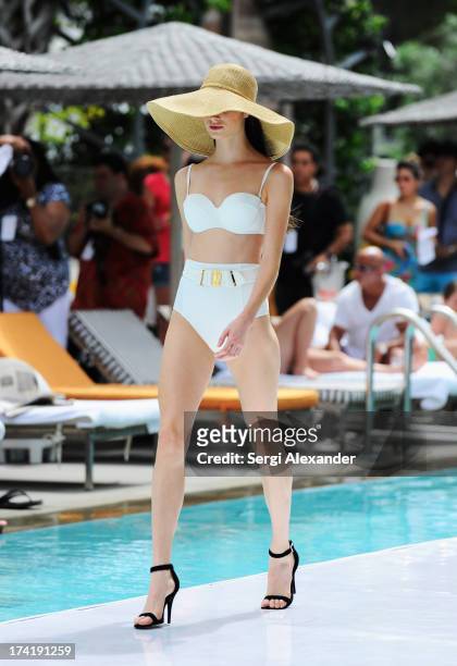 Model walks the runway at the Gottex show during Mercedes-Benz Fashion Week Swim 2014 at the SLS Hotel on July 21, 2013 in Miami, Florida.
