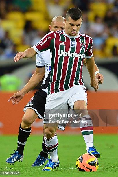 Wagner of Fluminense struggles for the ball during a match between Fluminense and Vasco as part of Brazilian Championship 2013 at Maracana Stadium on...