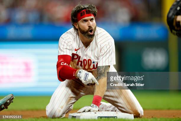 Jake Cave of the Philadelphia Phillies reacts to being tagged out at third bases while playing the Arizona Diamondbacks during Game Two of the...