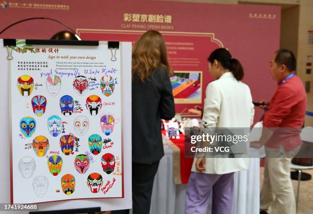 Clay Peking Opera masks exhibition booth is seen at the media center for the 3rd Belt And Road Forum For International Cooperation on October 17,...