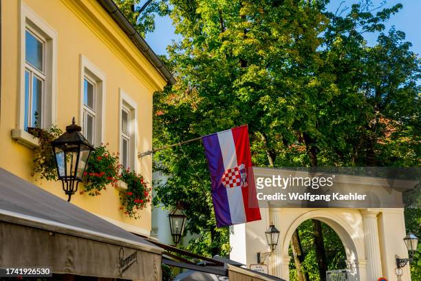 Street scene with a Croatian flag in the old town of Zagreb, Croatia.