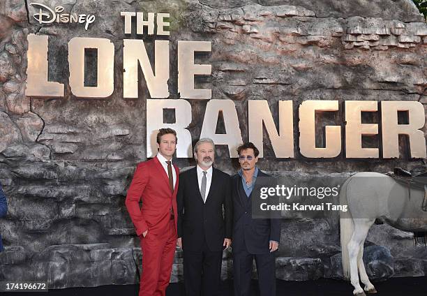 Armie Hammer, Gore Verbinski and Johnny Depp attend the UK Premiere of 'The Lone Ranger' at Odeon Leicester Square on July 21, 2013 in London,...