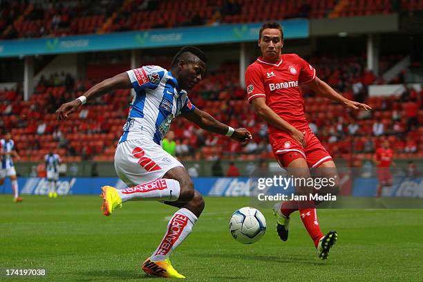 Gerardo Rodriguez of Toluca struggles for the ball with Duvier Riascos of Tijuana during the match between Toluca and Pachuca as part of the Apertura...