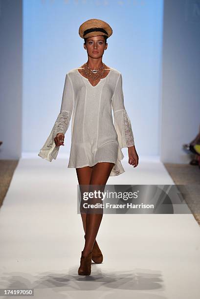 Model walks the runway at the L*Space By Monica Wise show during Mercedes-Benz Fashion Week Swim 2014 at Cabana Grande at the Raleigh on July 21,...