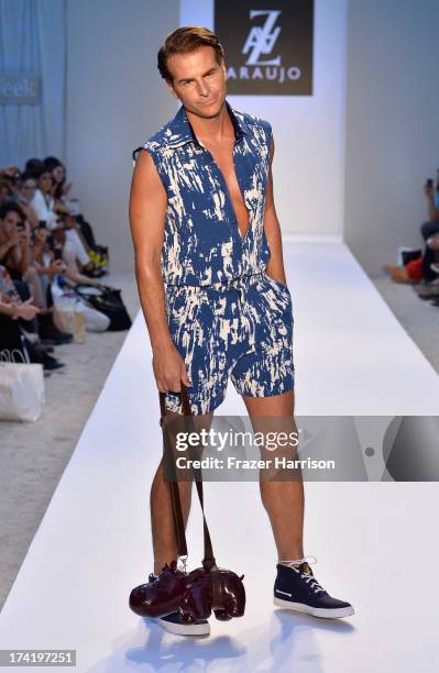 Actor Vincent de Paul walks the runway at the A.Z. Araujo show during Mercedes-Benz Fashion Week Swim 2014 at Oasis at the Raleigh on July 21, 2013...