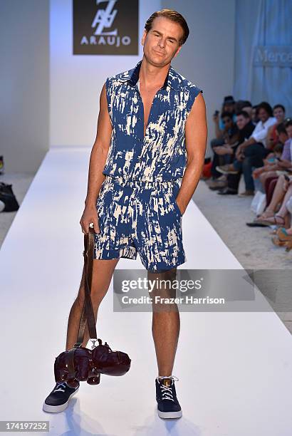 Actor Vincent de Paul walks the runway at the A.Z. Araujo show during Mercedes-Benz Fashion Week Swim 2014 at Oasis at the Raleigh on July 21, 2013...