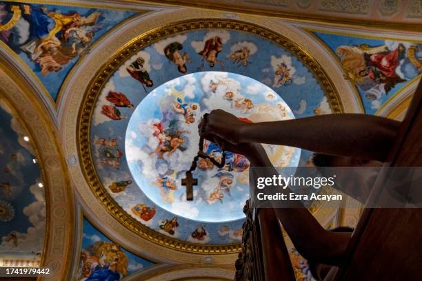 Filipino children pray the rosary as they take part in the "One Million Children Praying the Rosary for Unity and Peace" campaign, at the Immaculate...