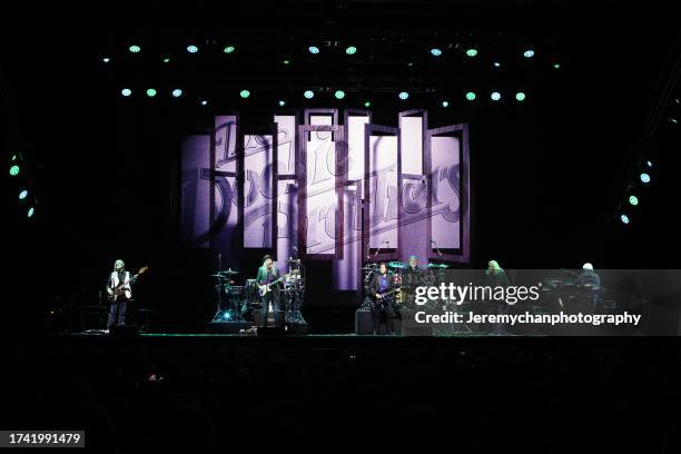 John Cowan, Patrick Simmons, John McFee, Ed Toth, Marc Russo, and Michael McDonald of The Doobie Brothers perform at Tribute Communities Centre on...