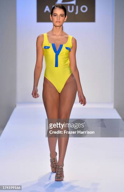 Model walks the runway at the A.Z. Araujo show during Mercedes-Benz Fashion Week Swim 2014 at Oasis at the Raleigh on July 21, 2013 in Miami, Florida.