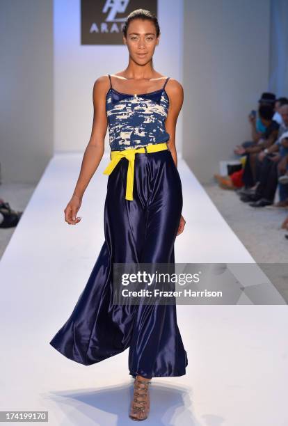 Model walks the runway at the A.Z. Araujo show during Mercedes-Benz Fashion Week Swim 2014 at Oasis at the Raleigh on July 21, 2013 in Miami, Florida.