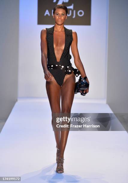 Model walks the runway at the A.Z. Araujo show during Mercedes-Benz Fashion Week Swim 2014 at Oasis at the Raleigh on July 21, 2013 in Miami, Florida.