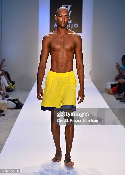 Model walks the runway at the A.Z. Araujo show during Mercedes-Benz Fashion Week Swim 2014 at Oasis at the Raleigh on July 21, 2013 in Miami, Florida.