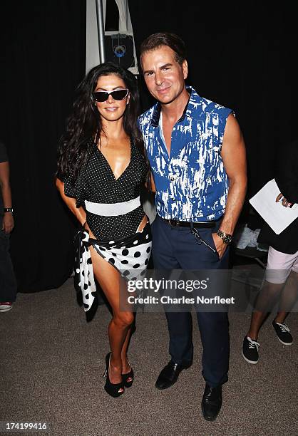 Personality Adriana DeMoura and actor Vincent De Paul pose backstage at the A.Z. Araujo show during Mercedes-Benz Fashion Week Swim 2014 at Oasis at...
