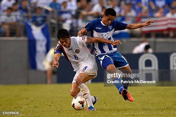 Andy Najar of Honduras battles for the ball against Juan Diego Madrigal of Costa Rica in the second half during the 2013 CONCACAF Gold Cup...