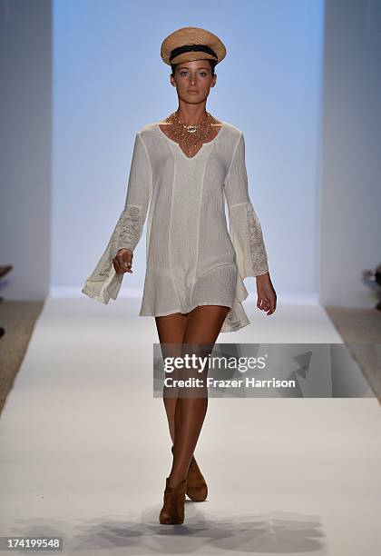 Model walks the runway at the L*Space By Monica Wise show during Mercedes-Benz Fashion Week Swim 2014 at Cabana Grande at the Raleigh on July 21,...