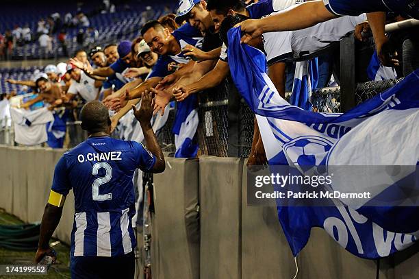 Osman Chavez of Honduras celebrates with fans after Honduras defeated Costa Rica 1-0 during the 2013 CONCACAF Gold Cup quarterfinal game at M&T Bank...