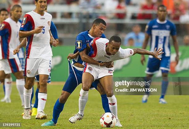Honduras' Rony Martinez vies with Costa Rica's Junior Diaz during a CONCACAF Gold Cup quarterfinal match in Baltimore on July 21, 2013. AFP PHOTO/JIM...