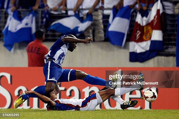 Osman Chavez of Honduras battles for the ball against Yeltsin Tejeda of Costa Rica during the 2013 CONCACAF Gold Cup quarterfinal game at M&T Bank...