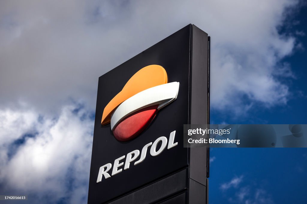 A logo on a totem sign at a Repsol SA gas station in the Zona Franca ...