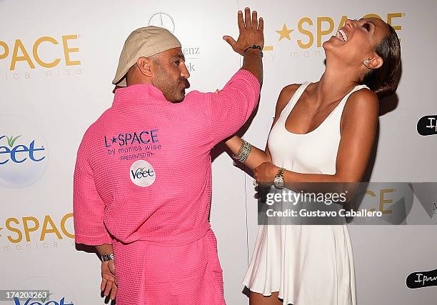 Personalities Joe Gorga and Melissa Gorga pose backstage with Ipanema at the L*SPACE By Monica Wise show during Mercedes-Benz Fashion Week Swim 2014...