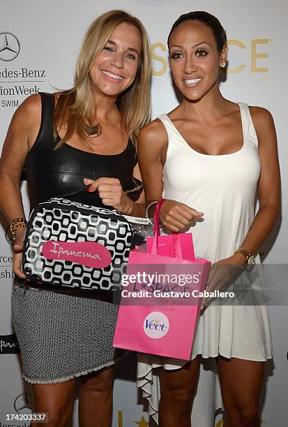 Designer Monica Wise and Melissa Gorga pose backstage with Ipanema at the L*SPACE By Monica Wise show during Mercedes-Benz Fashion Week Swim 2014 at...