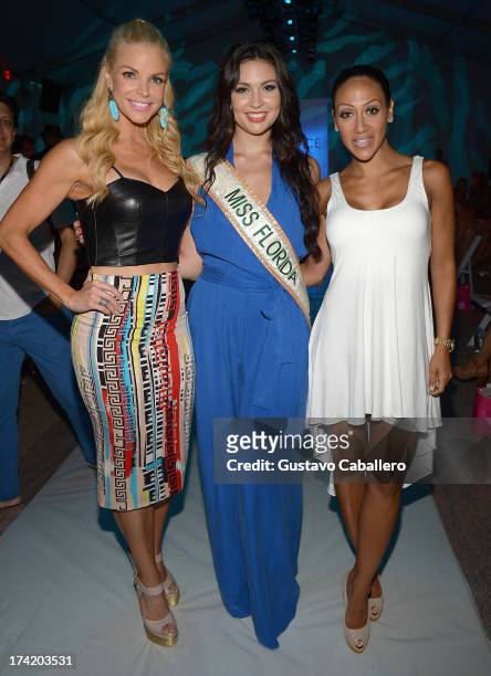 Alexia Echevarria, Cassandra Mandeville and Melissa Gorga pose with Ipanema at the L*SPACE By Monica Wise show during Mercedes-Benz Fashion Week Swim...