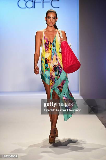 Model walks the runway at the Caffe Swimwear show during Mercedes-Benz Fashion Week Swim 2014 at Oasis at the Raleigh on July 21, 2013 in Miami,...
