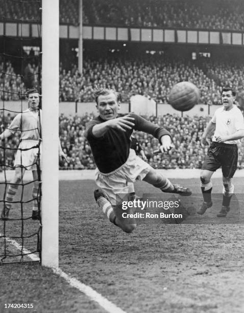 German goalkeeper Bert Trautmann , of Manchester City FC, makes a save during a First Division match against Tottenham Hotspur at White Hart Lane,...