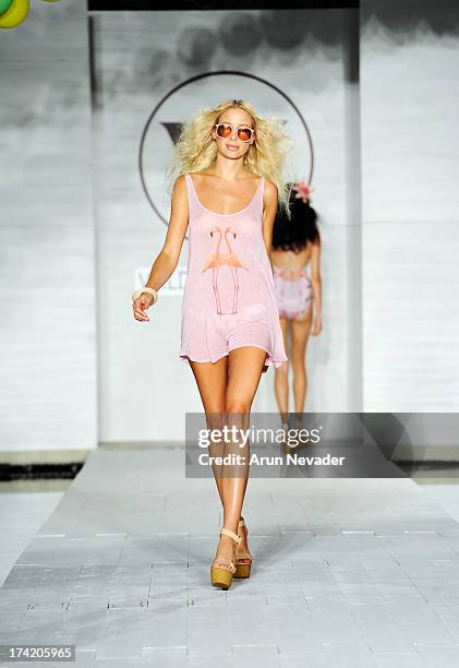 Model walks the runway at the Wildfox Swim Cruise 2014 show at Soho Beach House on July 21, 2013 in Miami Beach, Florida.