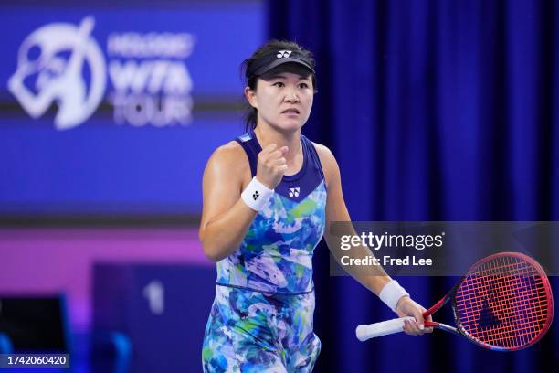 Zhu Lin of China celebrates after winning the match against Veronika Kudermetova in the women's singles 1st round match on Day 1 of the WTA Elite...