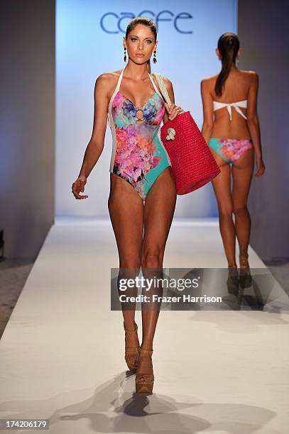 Model walks the runway at the Caffe Swimwear show during Mercedes-Benz Fashion Week Swim 2014 at Oasis at the Raleigh on July 21, 2013 in Miami,...