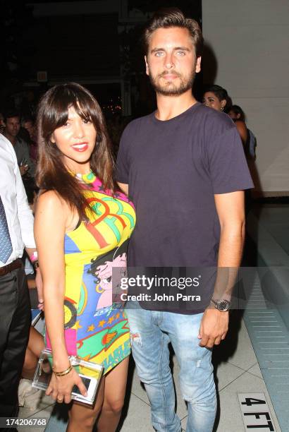 Personalities Kourtney Kardashian and Scott Disick attend the Wildfox Swim Cruise 2014 show at Soho Beach House on July 21, 2013 in Miami Beach,...