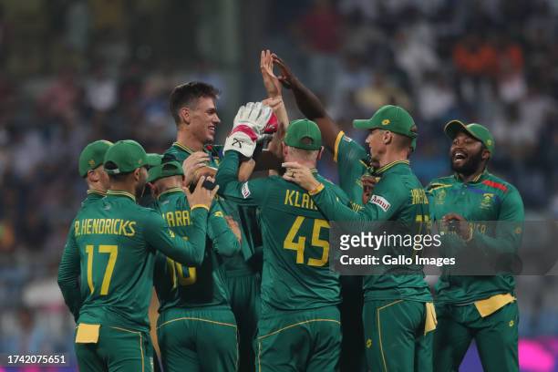 Marco Jansen of South Africa celebrates the wicket of Bangladesh's Mushfiqur Rahim during the ICC Men's Cricket World Cup 2023 match between South...