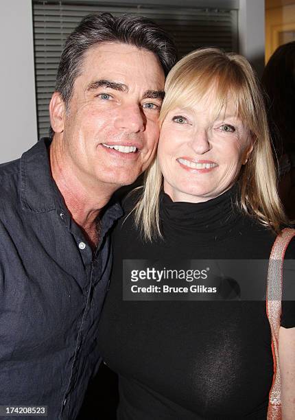 Peter Gallagher and his wife Paula Wildash pose backstage at his show "Where It All Began" at Below 54 on July 21, 2013 in New York City.