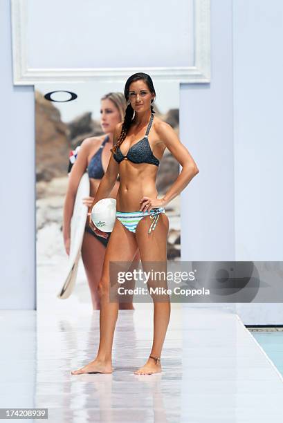 Model poses on the runway at the Oakley show during Mercedes-Benz Fashion Week Swim 2014 at the SLS Hotel on July 21, 2013 in Miami, Florida.