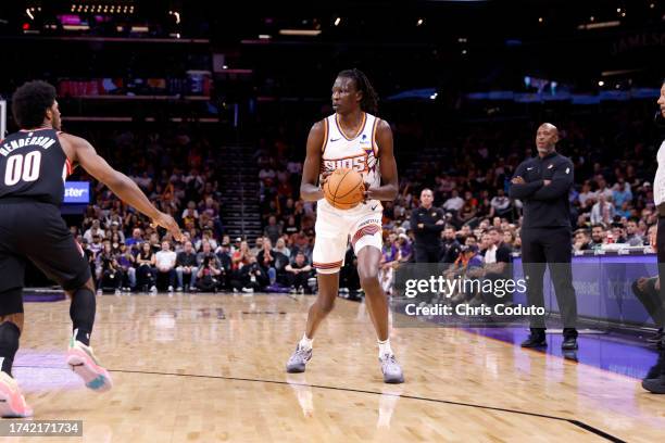 Bol Bol of the Phoenix Suns passes the ball during the game against the Portland Trail Blazers at Footprint Center on October 16, 2023 in Phoenix,...