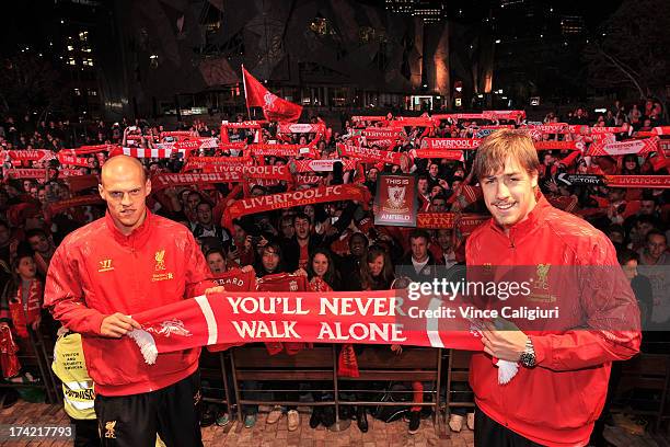 Martin Skrtel and Sebastian Coates of Liverpool FC pose for a photo in front of fans during a Liverpool FC player appearance at Federation Square on...