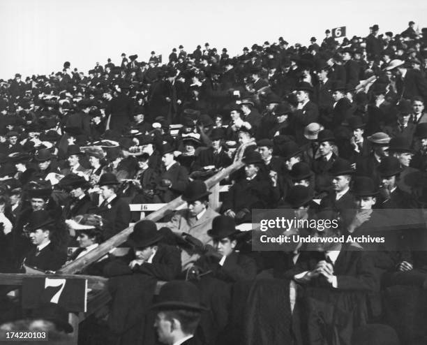 Football fans attending the Harvard-Yale game at Harvard Stadium in Allston, Boston, Massachusetts, 1905.