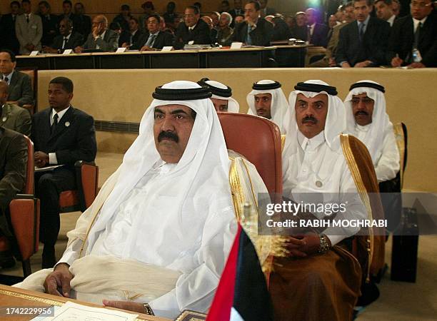 Emir of Qatar Sheikh Hamad Bin Khalifa al-Thani attends the opening session of the 16th Arab League Summit in Tunis 22 May 2004. Tunisian President...