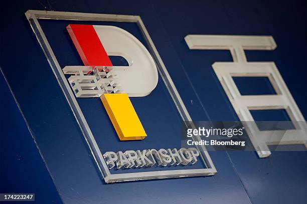 Signage is displayed outside a ParknShop supermarket, operated by Hutchison Whampoa Ltd., in Hong Kong, China, on Monday, July 22, 2013. Billionaire...