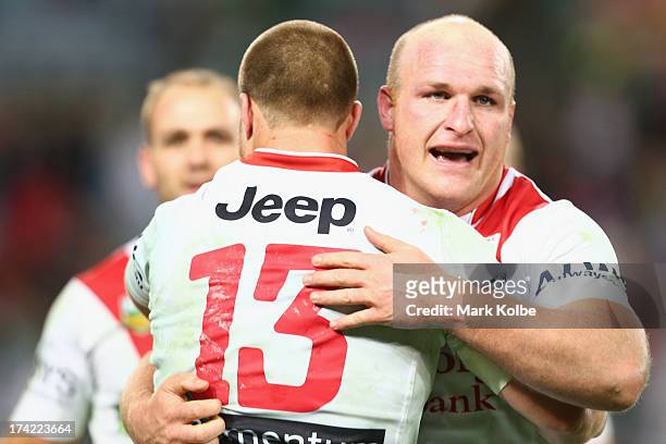 Trent Merrin and Michael Weyman of the Dragons after the match winning try during golden point time of the round 19 NRL match between the South...