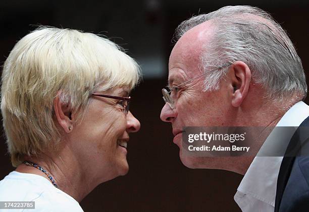 Former German Defense Minister Rudolf Scharping greets Committee Chairwoman Susanne Kastner as he arrives for the first parliamentary inquiry witness...
