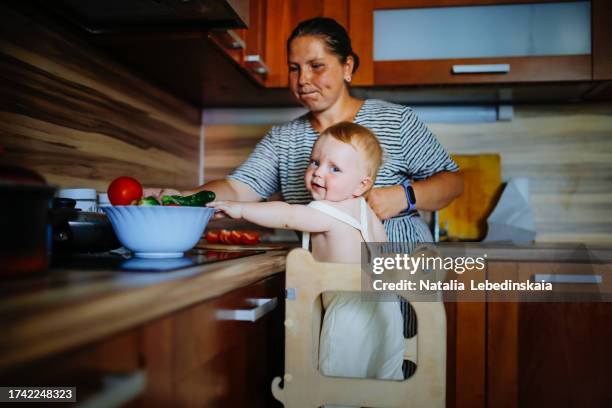 sensory exploration: plus-size mom and baby bond in the kitchen - day in the life series stock pictures, royalty-free photos & images