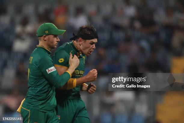 Gerald Coetzee of South Africa celebrates the wicket of Bangladesh's Nasum Ahmed during the ICC Men's Cricket World Cup 2023 match between South...