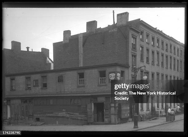 Old two-story brick building on an unidentified corner of Henry Street, Brooklyn, New York, New York, 1922.