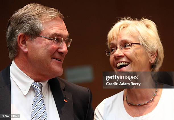 Former German Defense Minister Franz Josef Jung speaks to Committee Chairwoman Susanne Kastner as he arrives for the first parliamentary inquiry...