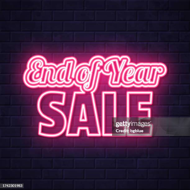 end of year sale. glowing neon icon on brick wall background - the end stock illustrations