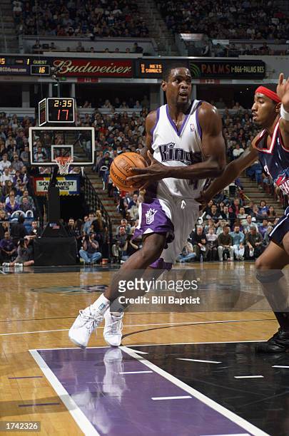 Chris Webber of the Sacramento Kings drives to the basket during the NBA game against the Houston Rockets at Arco Arena on December 1, 2002 in...