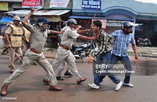 Policemen resort to lathicharge on the students protesting against new reservation policy of UP Public Service Commission on July 22, 2013 in...